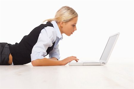 simsearch:400-04562604,k - Businesswoman working on her laptop while lying down on the floor Photographie de stock - Aubaine LD & Abonnement, Code: 400-04008490