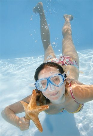 Pretty girl underwater with mask and starfish Foto de stock - Super Valor sin royalties y Suscripción, Código: 400-04008518