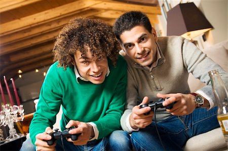 men having fun with a new videogame Stock Photo - Budget Royalty-Free & Subscription, Code: 400-04008620