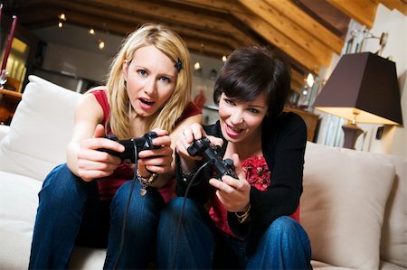 girls having fun with a new videogame Stock Photo - Budget Royalty-Free & Subscription, Code: 400-04008623