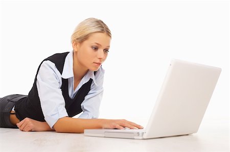 simsearch:400-05729276,k - Businesswoman working on her laptop while lying down on the floor Stock Photo - Budget Royalty-Free & Subscription, Code: 400-04008683