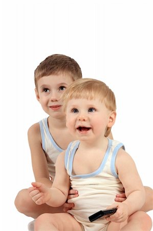 sergeitelegin (artist) - Two boys in identical clothes look in the chamber Stock Photo - Budget Royalty-Free & Subscription, Code: 400-04008755