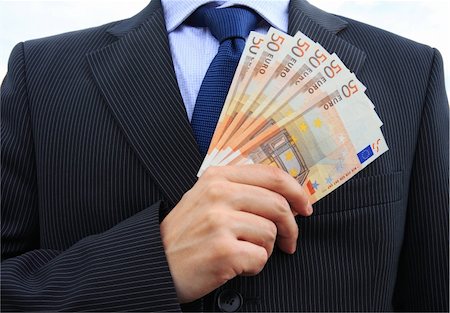 simsearch:400-04434826,k - Detail of a businessman hand with lot of money Fotografie stock - Microstock e Abbonamento, Codice: 400-04009189