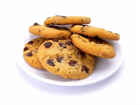 simsearch:614-06537660,k - Chocolate chip cookies on a plate isolated on white background Photographie de stock - Aubaine LD & Abonnement, Code: 400-04009223