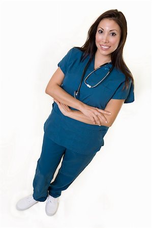 simsearch:400-03995908,k - Full body of an attractive young brunette Hispanic woman health care worker standing with a smiling friendly expression Stock Photo - Budget Royalty-Free & Subscription, Code: 400-04009446