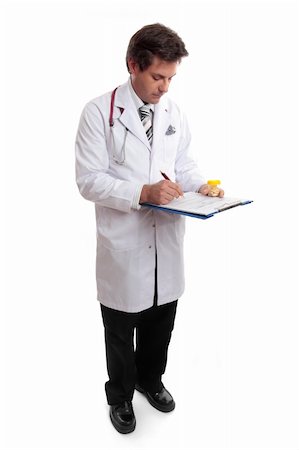 simsearch:400-04018969,k - A doctor or healthcare professional holding medication fills out a form Photographie de stock - Aubaine LD & Abonnement, Code: 400-04009710