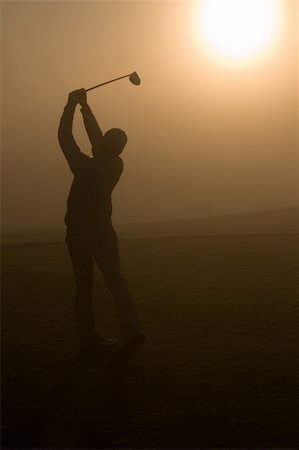 Golfers and a resort golf course in action Foto de stock - Royalty-Free Super Valor e Assinatura, Número: 400-04000377