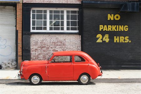 An old vintage car next to a no parking sign. Stock Photo - Budget Royalty-Free & Subscription, Code: 400-04000454