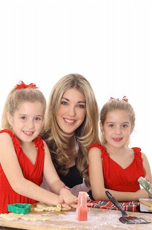 happy mom with twin daughters decorating cookies Stock Photo - Budget Royalty-Free & Subscription, Code: 400-04000572