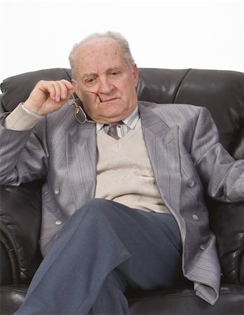 simsearch:400-03969432,k - Portrait of a senior man thinking deeply in his office armchair. Stock Photo - Budget Royalty-Free & Subscription, Code: 400-04000635