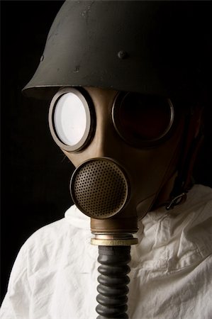 Person in gas mask on black background Stock Photo - Budget Royalty-Free & Subscription, Code: 400-04001108