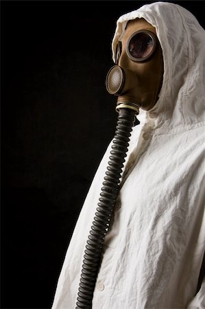 Person in gas mask on dark background Stock Photo - Budget Royalty-Free & Subscription, Code: 400-04001109