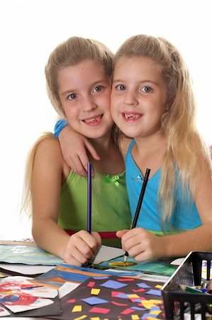 sisters coloring together vertical Foto de stock - Super Valor sin royalties y Suscripción, Código: 400-04001879