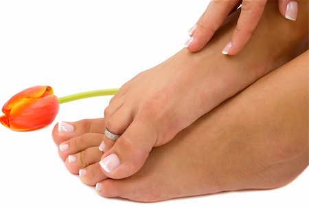 smelling feet - Pedicured foot and manicured hand with an elegant tulip Stock Photo - Budget Royalty-Free & Subscription, Code: 400-04001929