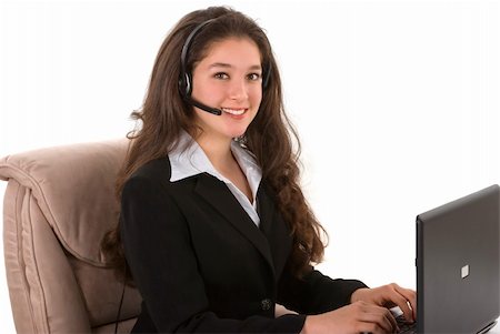 simsearch:400-03990860,k - Beautiful professionally dressed customer representative with her headset and computer Photographie de stock - Aubaine LD & Abonnement, Code: 400-04001946