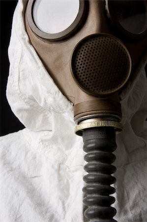 Person in gas mask on dark background Stock Photo - Budget Royalty-Free & Subscription, Code: 400-04002049