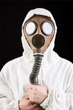 Person in gas mask on dark background Stock Photo - Budget Royalty-Free & Subscription, Code: 400-04002051