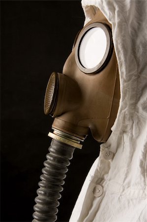 Person in gas mask on dark background Stock Photo - Budget Royalty-Free & Subscription, Code: 400-04002052