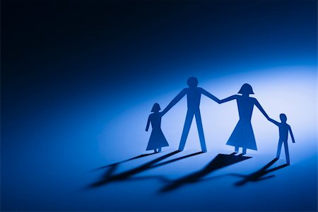 Paper cutout family of four standing holding hands. Stock Photo - Budget Royalty-Free & Subscription, Code: 400-04002743