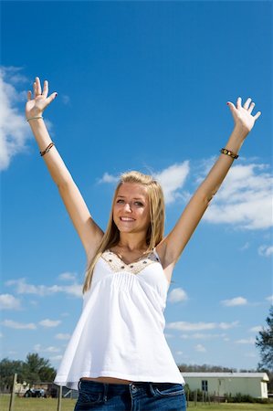 portrait photo teenage girl long blonde hair'''' - Beautiful blond teen girl outdoors raising her arms in freedom. Stock Photo - Budget Royalty-Free & Subscription, Code: 400-04003115