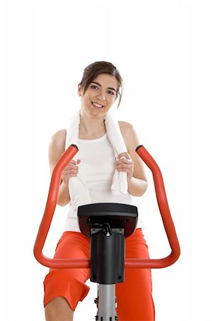 simsearch:400-04027186,k - Young woman training on exercise bike at the gym Stockbilder - Microstock & Abonnement, Bildnummer: 400-04003193