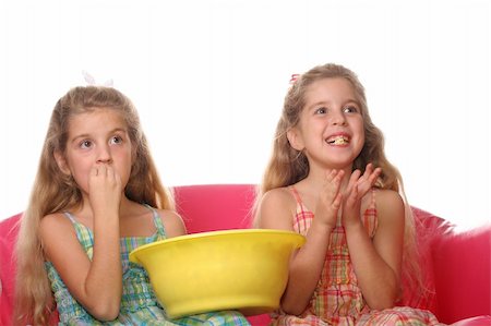 children watching a movie laughing & eating popcorn Stock Photo - Budget Royalty-Free & Subscription, Code: 400-04003264