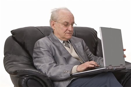 Close-up image of a senior man using a laptop.Shot with Canon 70-200mm f/2.8L IS USM Stock Photo - Budget Royalty-Free & Subscription, Code: 400-04003638