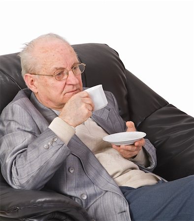 simsearch:400-03969432,k - Senior man drinking a cup of tea in his office armchair. Stock Photo - Budget Royalty-Free & Subscription, Code: 400-04003640