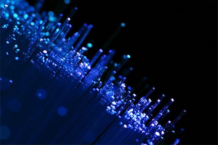 Fiber optics background with lots of blue light spots Stock Photo - Budget Royalty-Free & Subscription, Code: 400-04003665
