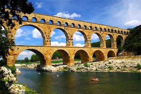 simsearch:400-04941299,k - Pont du Gard is a part of Roman aqueduct in southern France near Nimes. Photographie de stock - Aubaine LD & Abonnement, Code: 400-04003817
