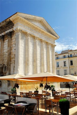 Roman temple Maison Carree and outdoor cafe in city of Nimes in southern France Stock Photo - Budget Royalty-Free & Subscription, Code: 400-04003811