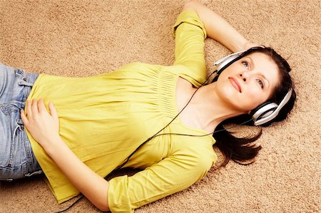 Beautiful women listening music in headphones Stock Photo - Budget Royalty-Free & Subscription, Code: 400-04014827