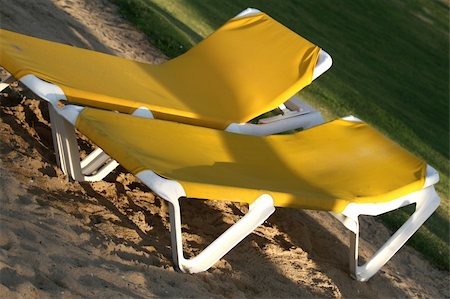 simsearch:400-06947087,k - yellow chaise longues on the sand beach in the sunlight Stock Photo - Budget Royalty-Free & Subscription, Code: 400-04014863