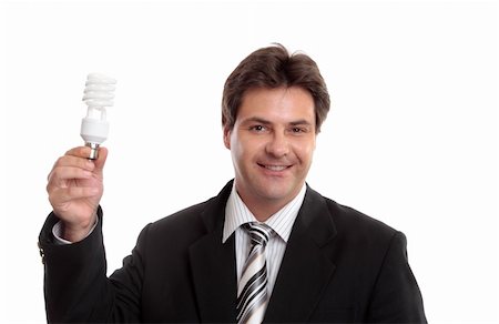 Businessman holding up an eco energy efficient light globe. Stockbilder - Microstock & Abonnement, Bildnummer: 400-04014990