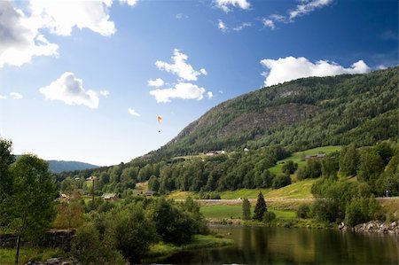 A Norwegian mountain landscape with a parachute in the sky Stock Photo - Budget Royalty-Free & Subscription, Code: 400-04015134