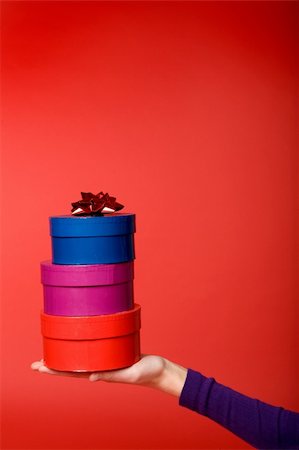 simsearch:614-02984866,k - A stack of three gifts isolated on red with room for copy space Stockbilder - Microstock & Abonnement, Bildnummer: 400-04015828