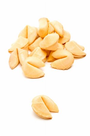 sascha (artist) - fortune cookie single with pile in the background, closeup isolated on white Fotografie stock - Microstock e Abbonamento, Codice: 400-04015895