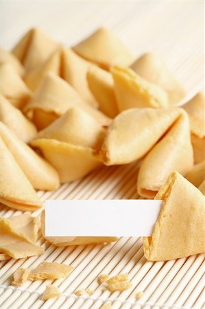 fortune cookie open with paper and space for text, whole text area in focus Foto de stock - Royalty-Free Super Valor e Assinatura, Número: 400-04015892