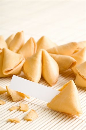 fortune cookies with blank paper for your own fortune, closeup with whole text area in focus Foto de stock - Royalty-Free Super Valor e Assinatura, Número: 400-04015893