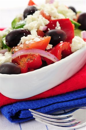 person eating greek salad - Greek salad with feta cheese and black kalamata olives Stock Photo - Budget Royalty-Free & Subscription, Code: 400-04016134