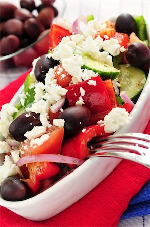 person eating greek salad - Greek salad with feta cheese and black kalamata olives Stock Photo - Budget Royalty-Free & Subscription, Code: 400-04016135