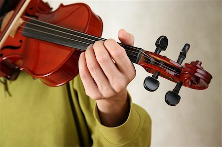 simsearch:400-05292647,k - Musician playing violin close-up in studio Stock Photo - Budget Royalty-Free & Subscription, Code: 400-04016330