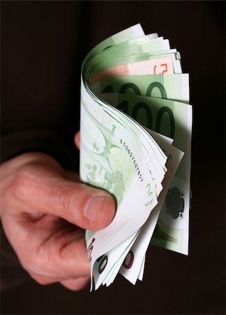 simsearch:400-06921414,k - Hand giving Euro banknotes money Photographie de stock - Aubaine LD & Abonnement, Code: 400-04016452