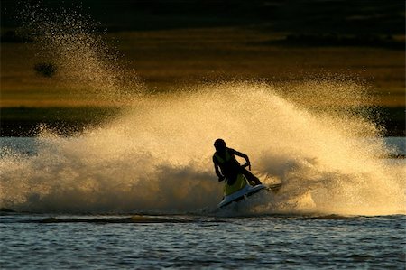 Backlit jet ski with water spray, late afternoon Stock Photo - Budget Royalty-Free & Subscription, Code: 400-04016800