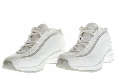 A pair of white basketball shoes isolated on a white background. Photographie de stock - Aubaine LD & Abonnement, Code: 400-04017224
