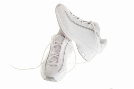 A pair of white basketball shoes isolated on a white background. Stockbilder - Microstock & Abonnement, Bildnummer: 400-04017222