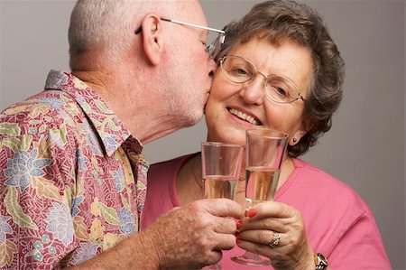 simsearch:400-04522125,k - Happy Senior Couple toasting with Champagne glasses. Stock Photo - Budget Royalty-Free & Subscription, Code: 400-04017416