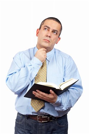 simsearch:400-03916433,k - Serious business man thinking and holding one book over a white background Foto de stock - Super Valor sin royalties y Suscripción, Código: 400-04017592
