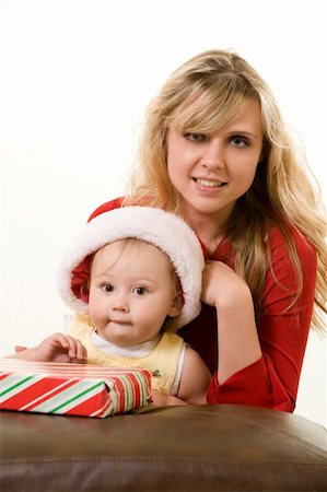 Adorable caucasian blond baby girl toddler sitting with mom a wearing Santa cap Stock Photo - Budget Royalty-Free & Subscription, Code: 400-04017835