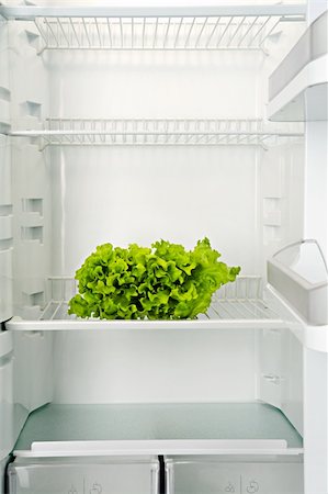 fridge shop - The bunch of green fresh salad lays in an empty refrigerator Stock Photo - Budget Royalty-Free & Subscription, Code: 400-04018206